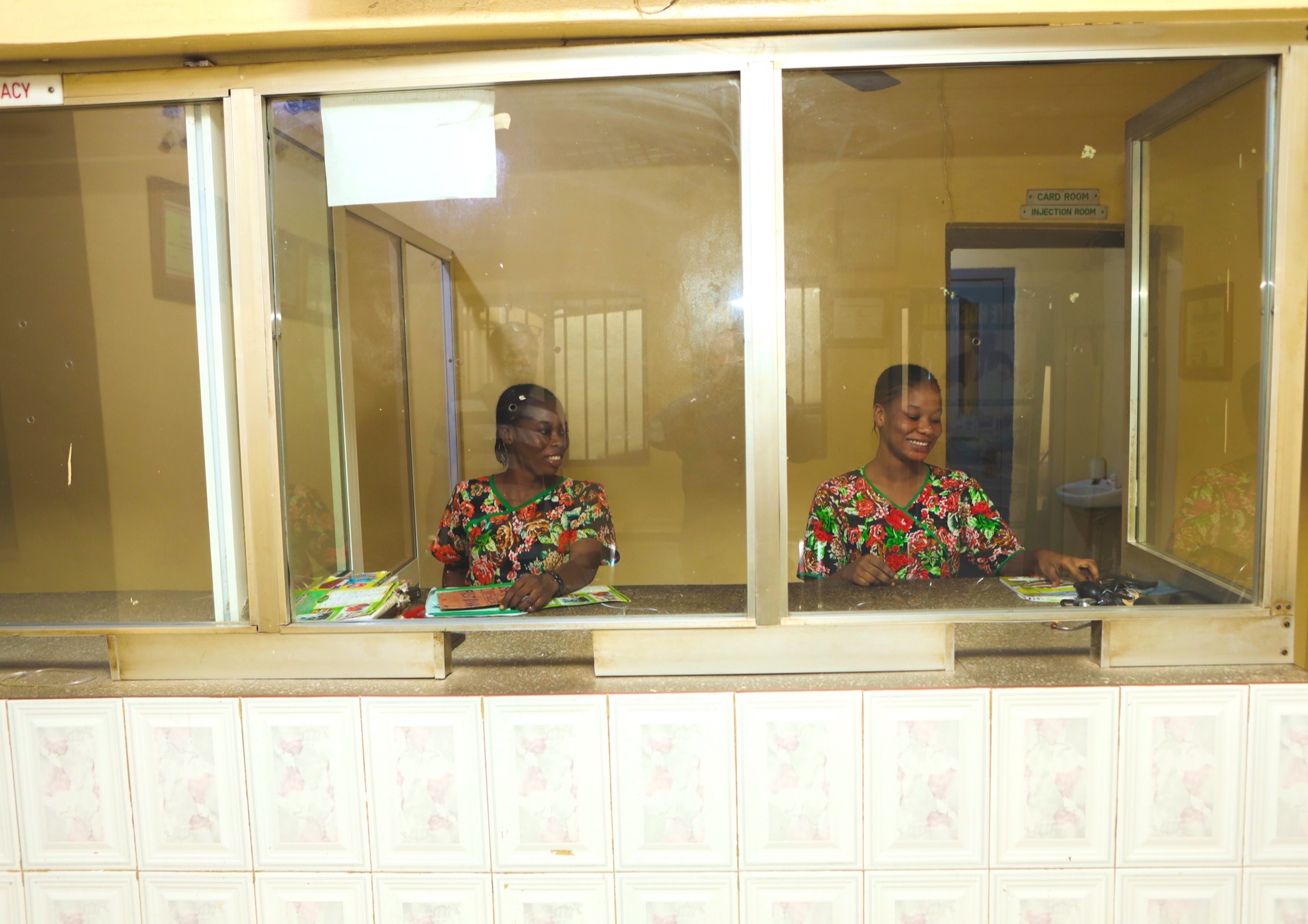 IYE Hospital pharmacy service counter with staff